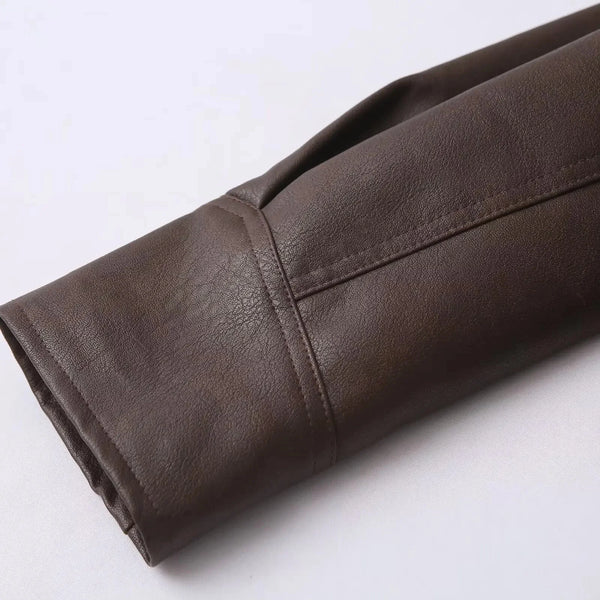 Chic belted leather bomber jacket for women, featuring lace-up detail and hood, perfect for autumn and winter fashion.