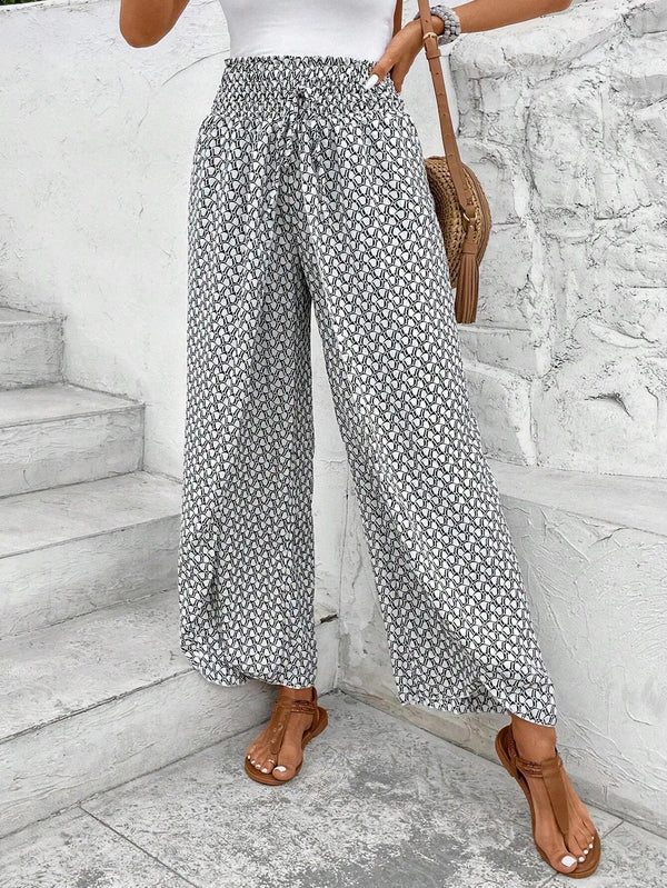 Floral wide-leg chiffon pants for women, ankle-length, elastic waist, perfect for summer fashion and casual chic outfits.
