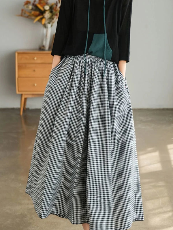 Chic plaid wide-leg pants in cotton-linen blend, featuring a high waist, pockets, and elastic waistband for comfort and style