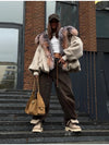 Oversized cotton-padded hooded jacket with zipper front and cozy silhouette
