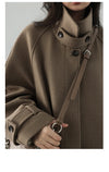 Refined wool polyester trench featuring elegant length and belted design