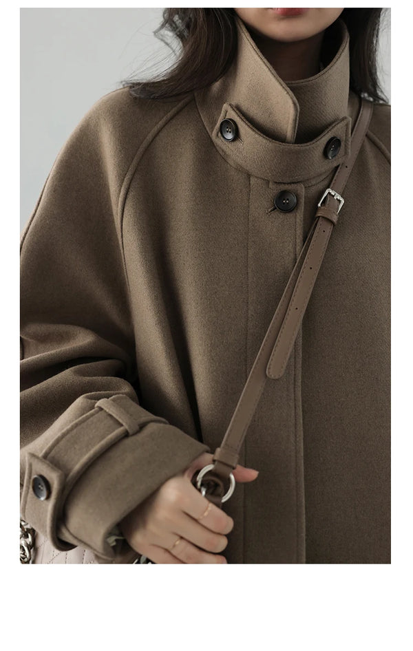 Refined wool polyester trench featuring elegant length and belted design