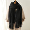 Cozy winter scarf in soft taupe, perfect for draping.