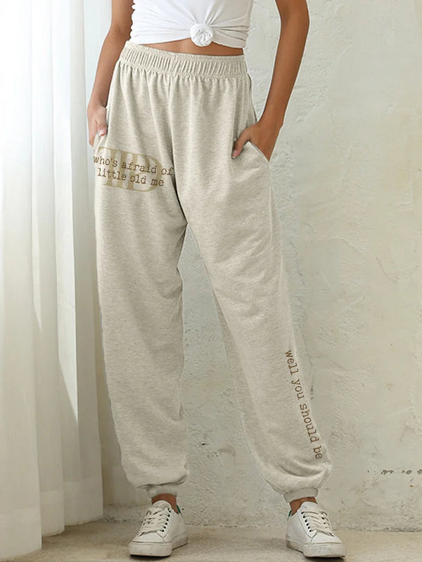 Chic high-waist joggers with 3D print, pockets, and elastic drawstring for comfort and style in any casual setting.