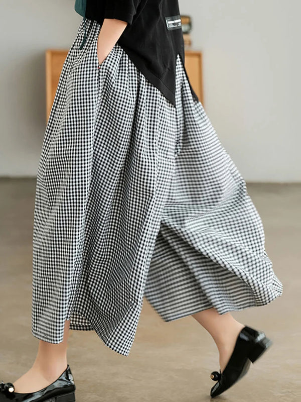 Chic plaid wide-leg pants in cotton-linen blend, featuring a high waist, pockets, and elastic waistband for comfort and style