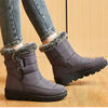 Chic women's waterproof winter boots with plush lining, low heel, and durable design for stylish cold-weather comfort.