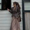Chic belted leather bomber jacket for women, featuring lace-up detail, hood, and notched lapel, perfect for autumn and winter