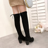 Chic over-the-knee black boots with chunky heels, lace-up detail, and soft lining for stylish comfort this fall.