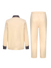 Men's cultural outfit featuring African print patchwork shirt with full-length sleeves and matching pants