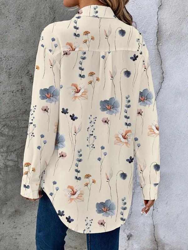 Elegant floral print women's blouse with batwing sleeves, perfect for everyday wear and versatile styling options.