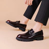 Polished black Oxfords with a classic silhouette for formal wear.