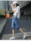 Comfortable calf-length harem jeans featuring elastic waist and cotton-polyester fabric