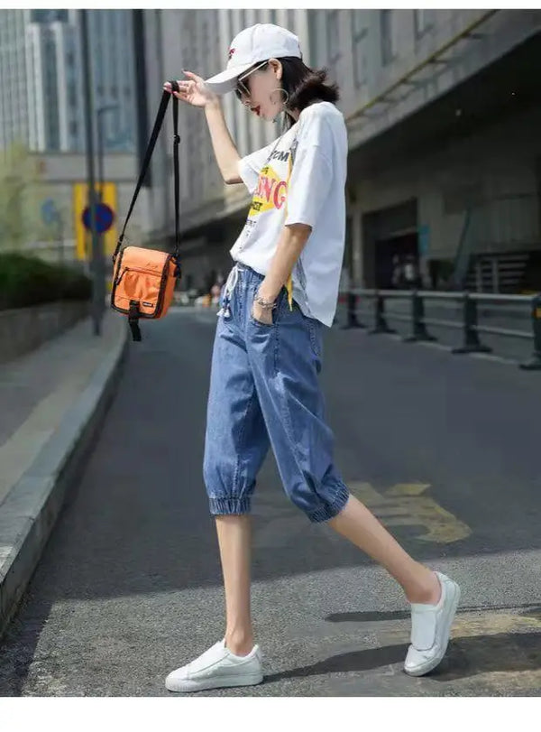 Comfortable calf-length harem jeans featuring elastic waist and cotton-polyester fabric