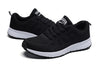 Women's white mesh sneakers with multi-color accents for all-day comfort