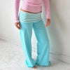 Versatile striped pants transitioning from sleepwear to casual wear