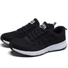 White sports footwear featuring mesh lining and vibrant color accents