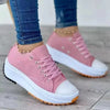 Five colorways of canvas low-top sneakers laid flat