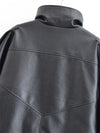 Chic black faux leather moto jacket for women, perfect for autumn evenings and stylish casual wear with functional pockets.