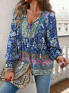 Bohemian lace-up V-neck blouse for women with vibrant print, lantern sleeves, and loose fit, perfect for spring and summer.