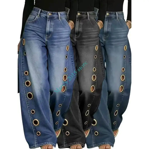 Retro washed denim jeans featuring wide leg cut and modern metal grommet embellishments