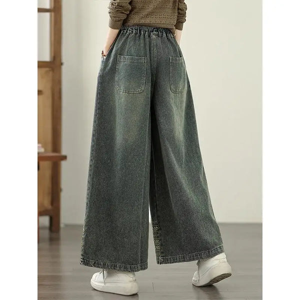 Vintage embroidered wide-leg jeans for women in light wash, featuring elastic waist and ethnic-inspired design. Perfect autum