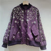 Stand-up collar jacket styled for evening wear with shimmering embellishments
