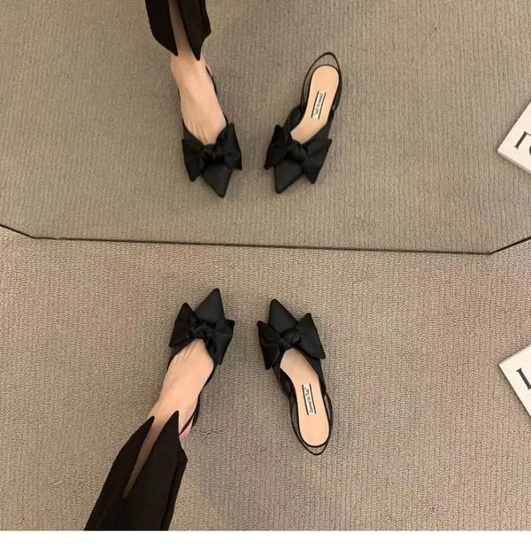 Beige pointed toe sandals with elegant bow accent and true-to-size fit