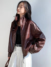 Functional side pockets on the black cropped leather jacket for women.