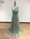 Glamorous look of the beaded gown under chandelier light, emphasizing its captivating design.