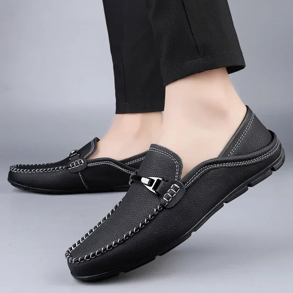 Durable rubber outsole on premium leather loafers for men.