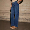 Chic high-waisted wide-leg jeans for women, featuring a relaxed fit, distressed details, and practical pockets for stylish co
