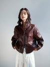 Front view of the tailored fit of the vintage leather cropped jacket for women.