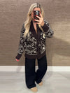 Woman wearing Fair Isle print cardigan with adjustable tie waist and regular fit