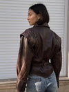Chic belted leather bomber jacket for women, featuring a slim fit, lace-up detail, and hood for stylish autumn and winter wea