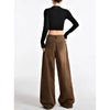 Vintage high-waist wide-leg jeans for women in light wash, featuring a button-fly closure and retro '90s style.