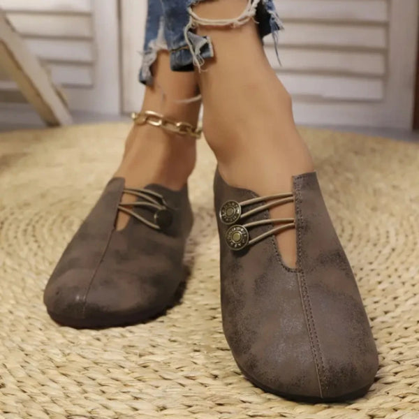 Side view of women's slip-on flats with TPR sole and polished leather upper