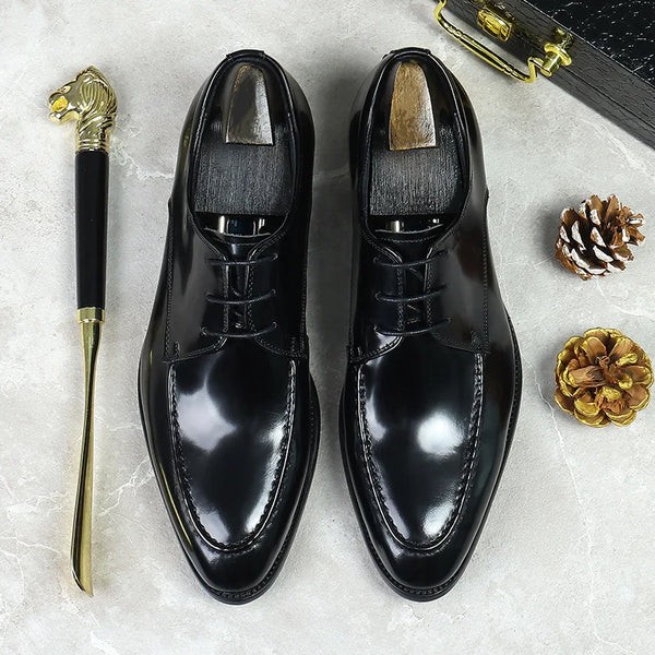Elegant black leather Oxfords with pigskin lining for all-day comfort.