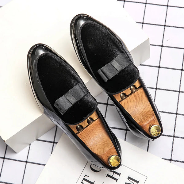 Luxury men's dress shoes in sleek black patent leather for formal wear.