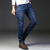 Men's straight-leg denim jeans in classic blue wash with stretch comfort technology and zipper fly