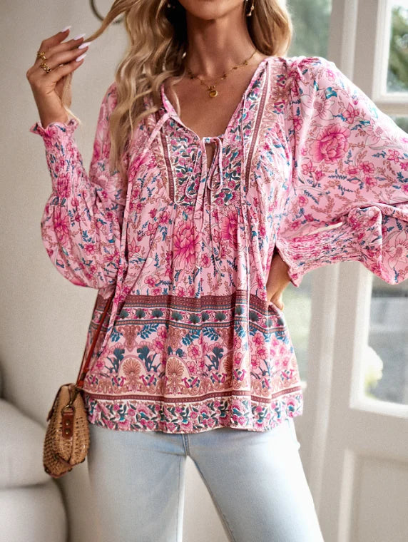 Bohemian lace-up V-neck blouse for women with vibrant print, lantern sleeves, and loose fit, perfect for spring and summer.