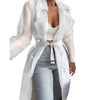 Close-up of functional pockets and clean lines on sheer belted trench coat