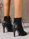 Stage-ready boots with cross-tied straps and quick-change side zipper for performers