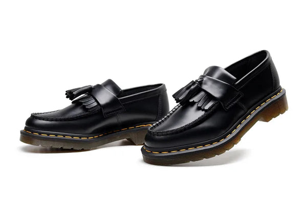 Black tassel loafers featuring a stylish and breathable design.