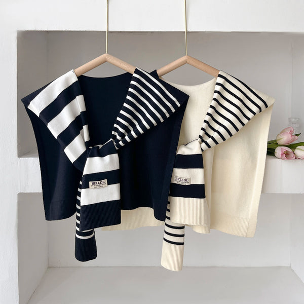 Soft, premium polyester scarf draped elegantly over shoulders.