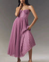 High-waist pullover evening dress with flowing pleats and architectural suspender detail