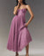 High-waist pullover evening dress with flowing pleats and architectural suspender detail
