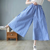 Chic plaid wide-leg pants in cotton-linen blend, featuring a high waist, pockets, and a comfortable elastic waistband.