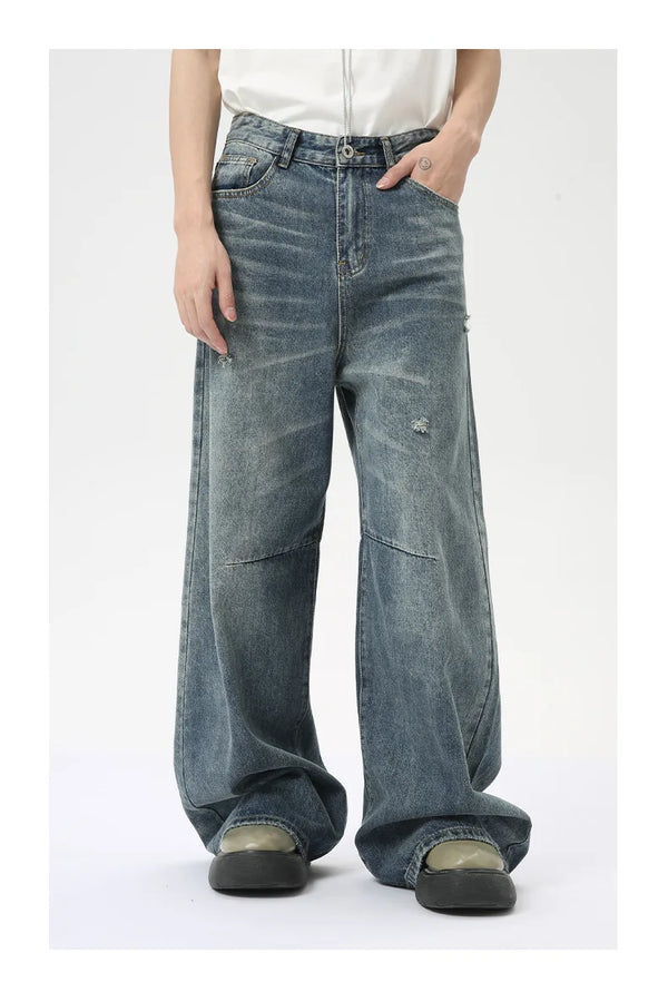 Premium washed blue denim jeans with wide leg and slight stretch