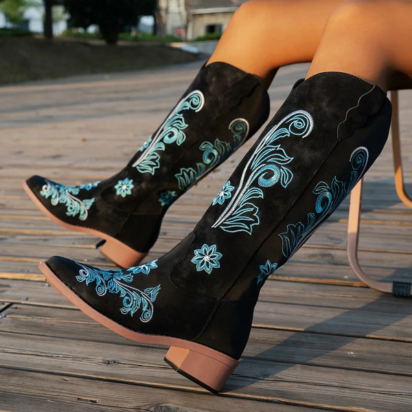 Embroidered mid-calf women's fashion boots with low wedge heel, slip-on design, and durable rubber outsole for comfort.