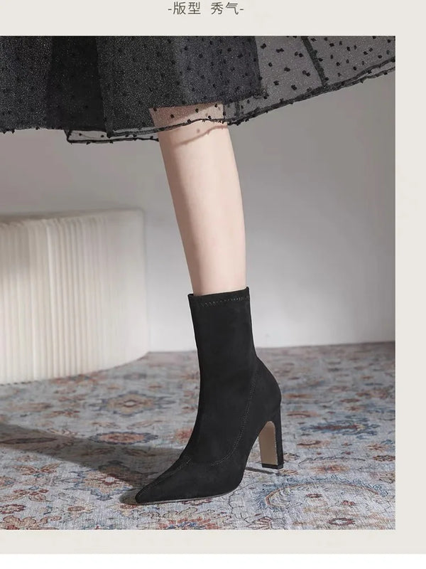 Chic black ankle boots with slim high heels, pointed toe design, perfect for autumn and winter fashion. Stylish slip-on footw